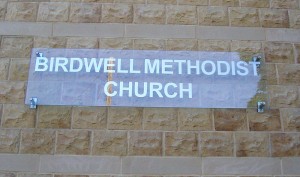 external church sign with lettering on clear perspex