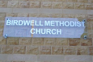 external church sign with lettering on clear perspex
