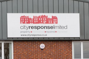 large outdoor sign on exterior of building