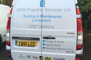 van with branded vehicle graphics on the back