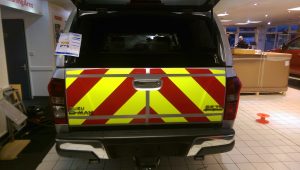 Photo of a jeep with reflective safety graphics